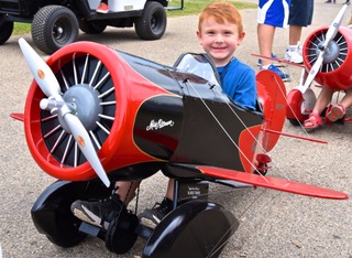 kid in a pedal plane